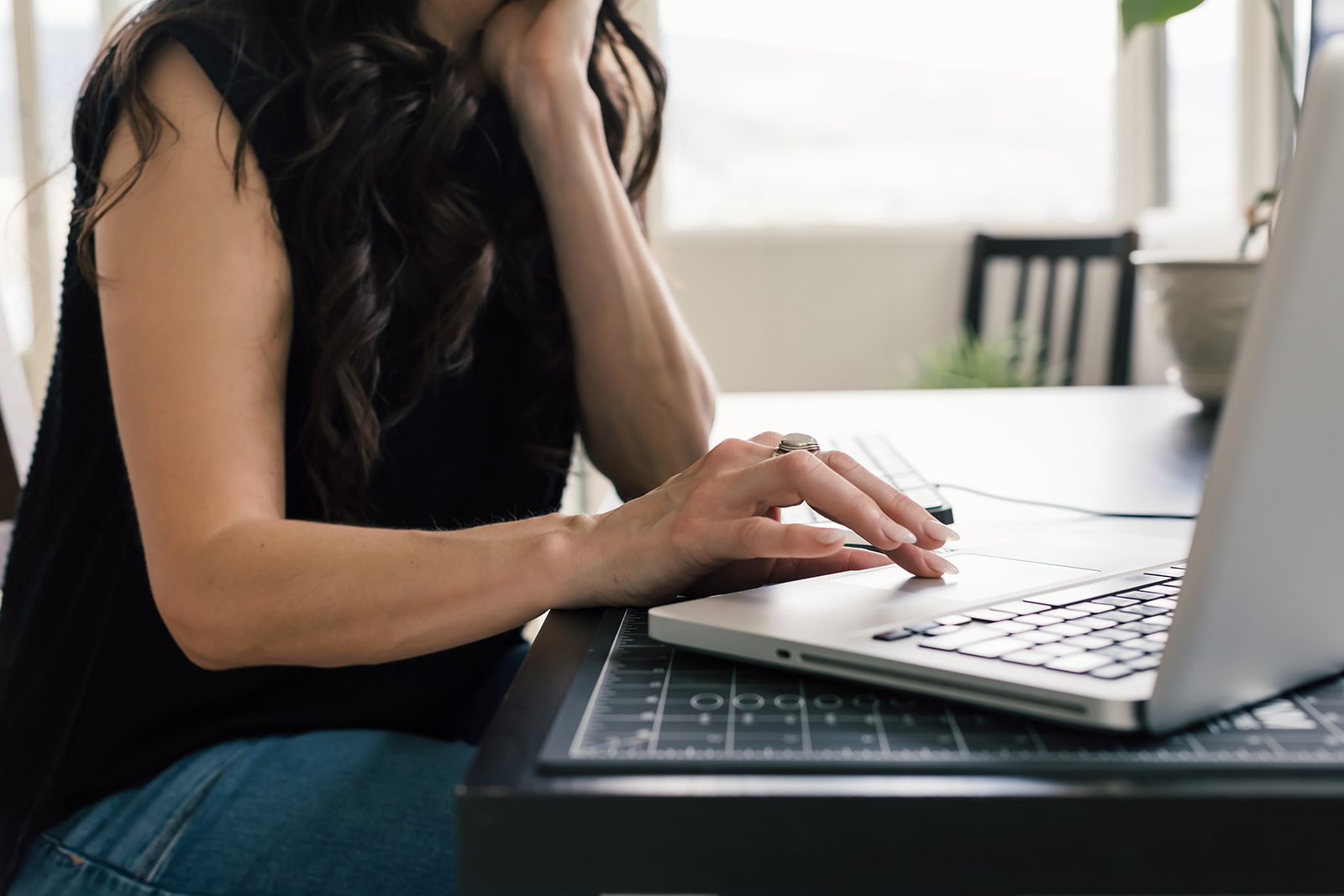 Service provider writing an email newsletter as part of a calm email marketing workflow using lead magnet ideas