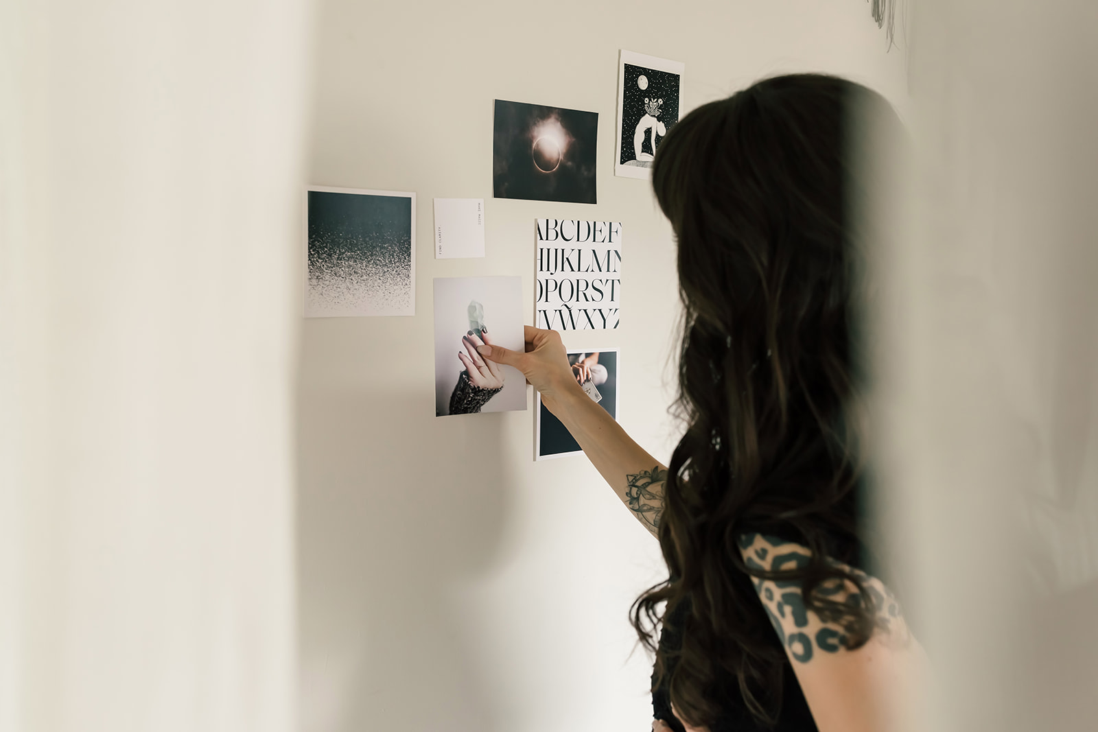 Brand designer curating visual inspiration and creative direction during the early stages of a custom branding process